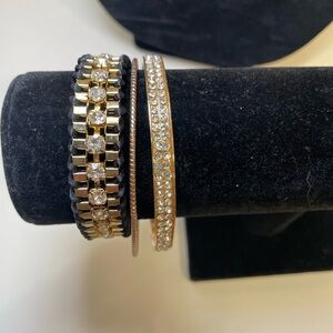 Three Gold Tone and Black Stacking Bracelet Set